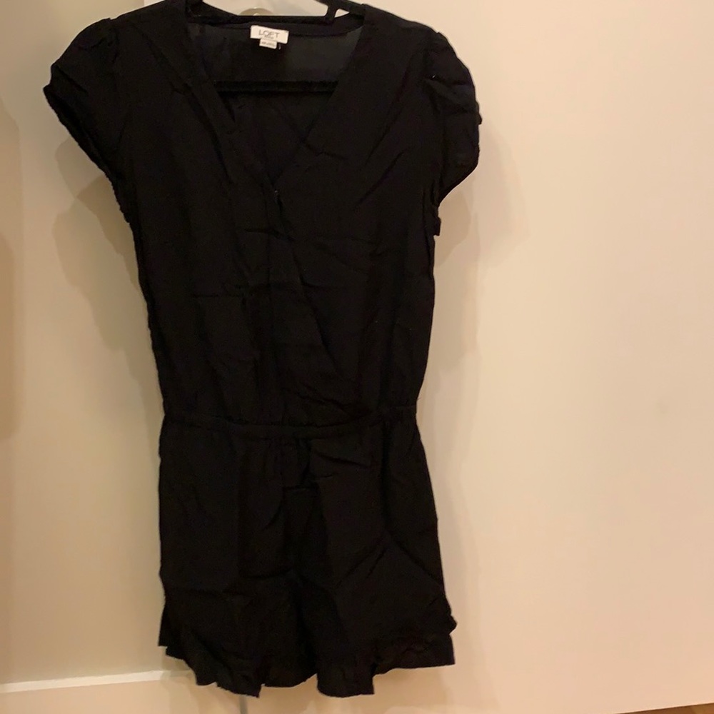 Black v neck romper with ruffled shorts